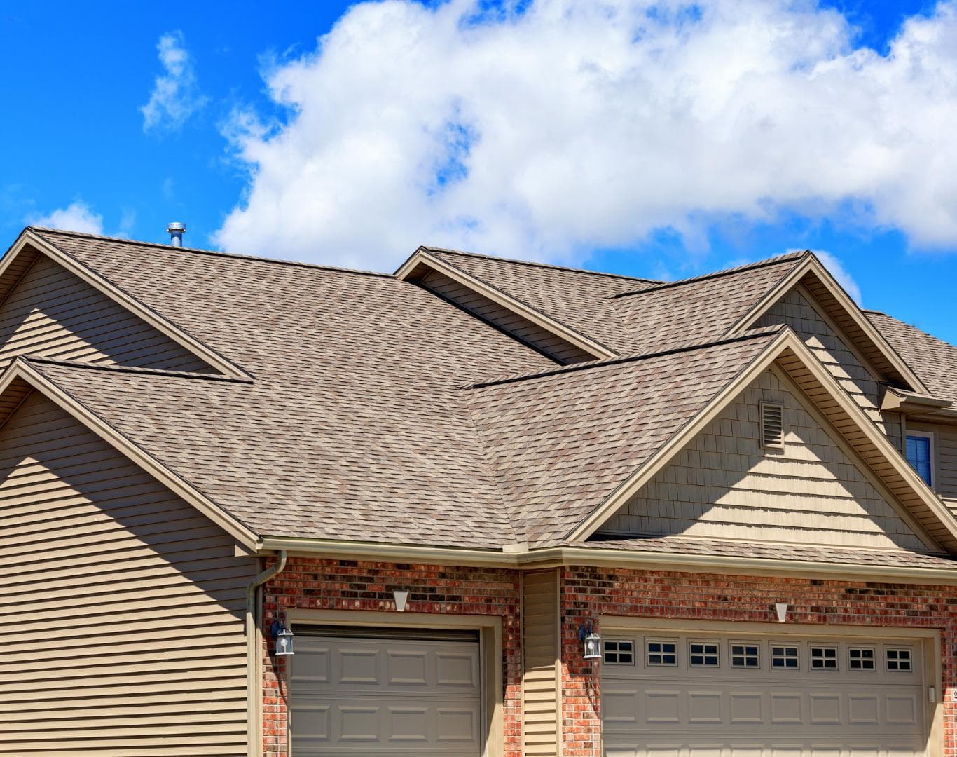 Roofing contractor on a Kearney, NE home near campus