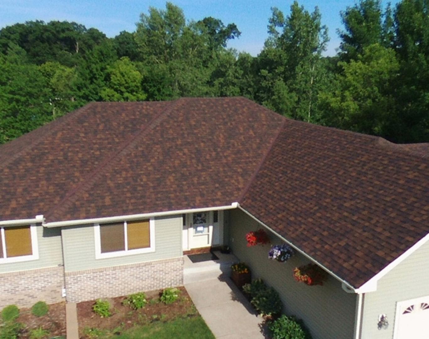 Lincoln, Nebraska roofing contractor reviewing a hail-damaged roof