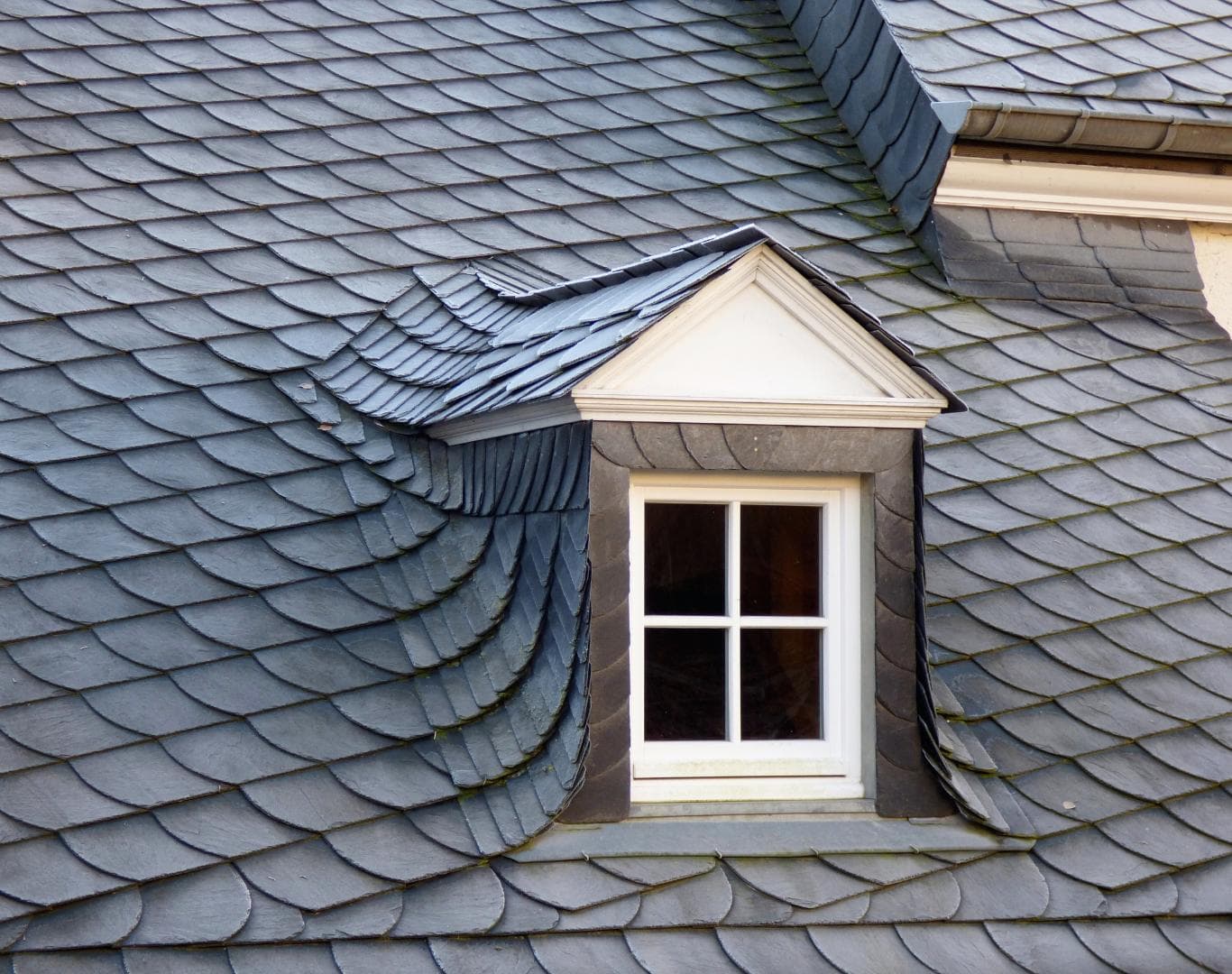 Slate roof and dormer showing woven valley detail