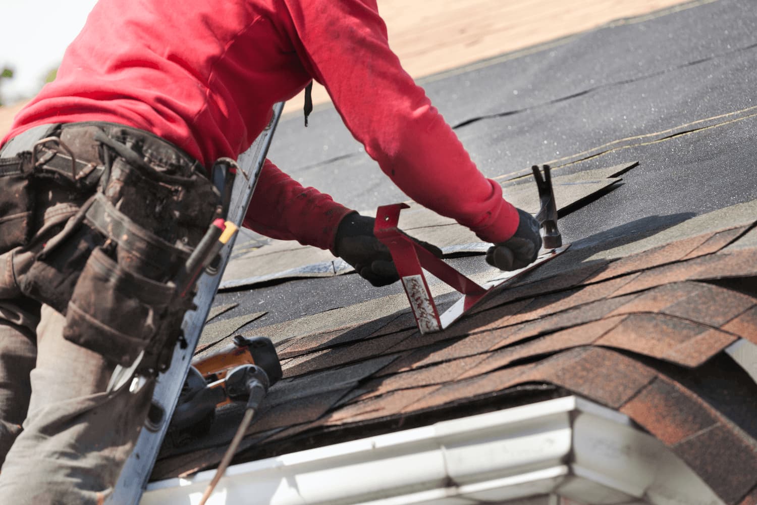 Technician replacing a split plumbing vent boot on an Omaha, NE roof