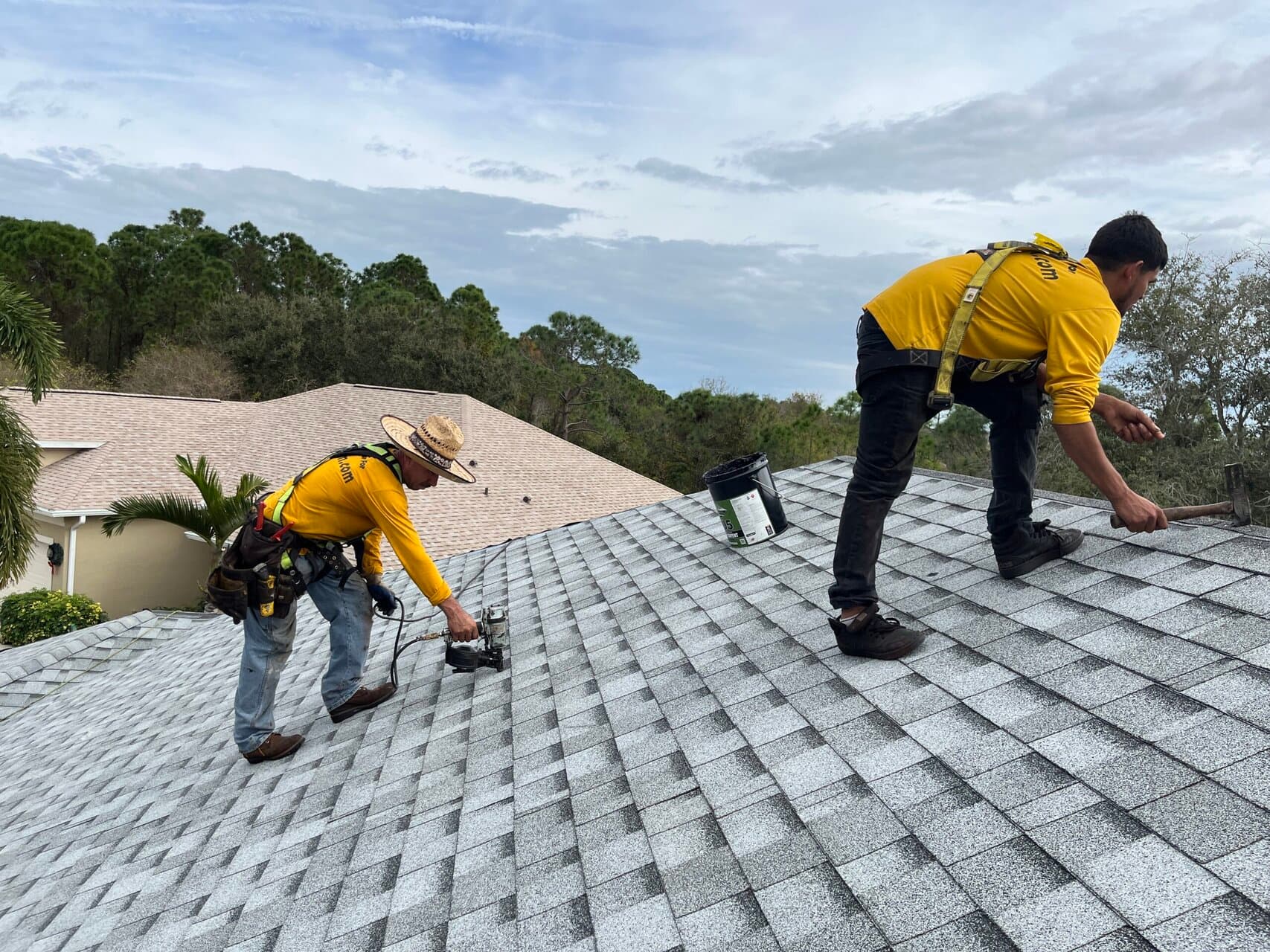 Kutsch Roofing technician inspecting a damaged roof in Omaha, Nebraska