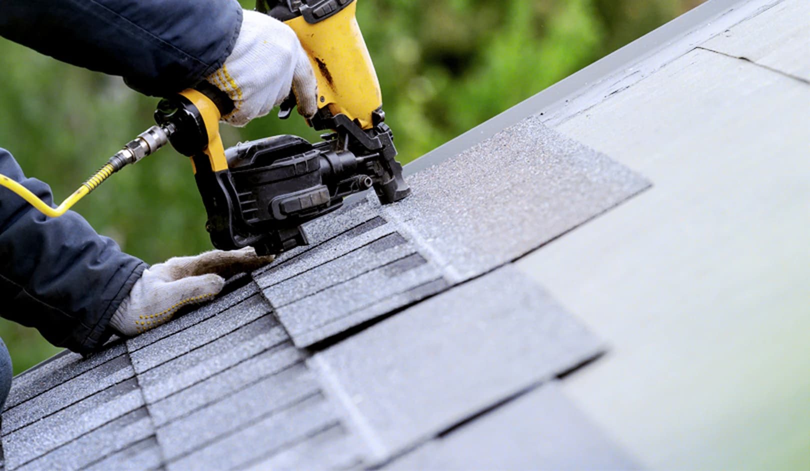 Crew installing new architectural shingles during a replacement in Omaha, Nebraska